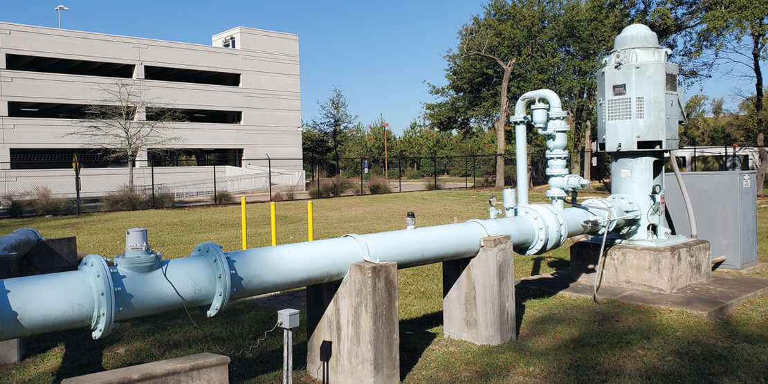 A drainage pipe outside of a parking garage