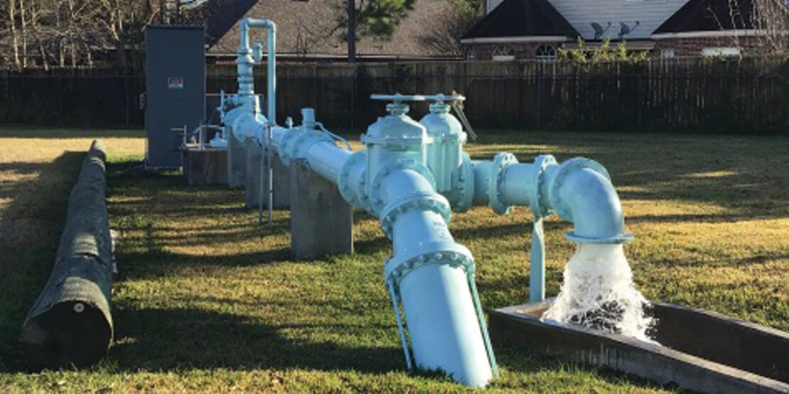 A water pipe at emptying fresh water into a trough