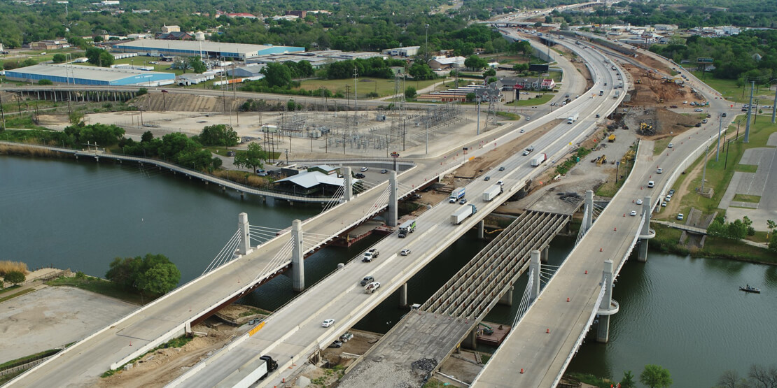 An aerial view of the IH 35 Waco 4B freeway bridge over water