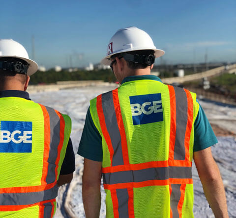 Two BGE colleagues at an outside worksite in PPE.