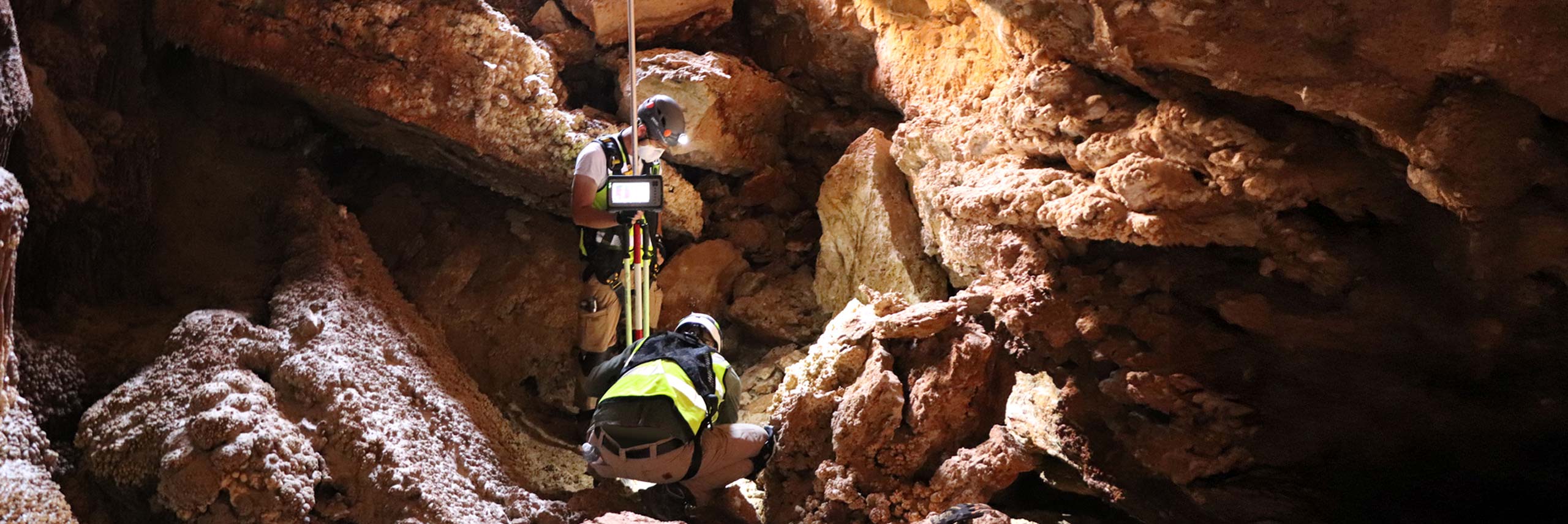 A BGE survey team working in a cave