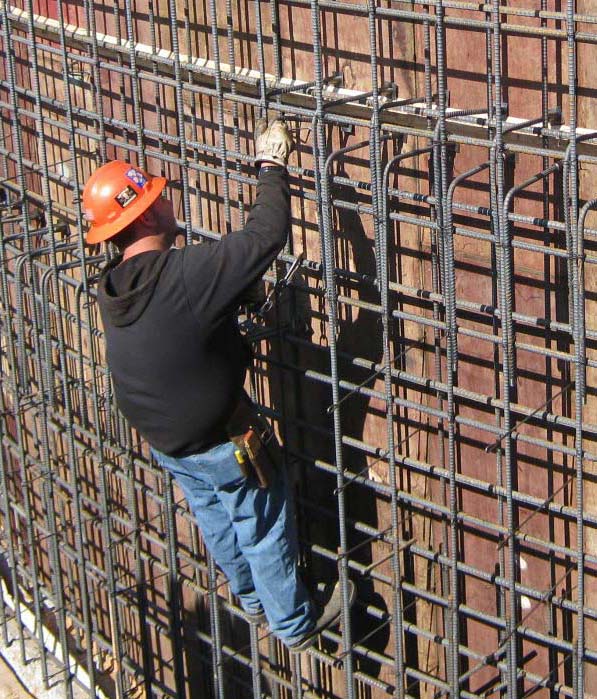 A man checking steel supports